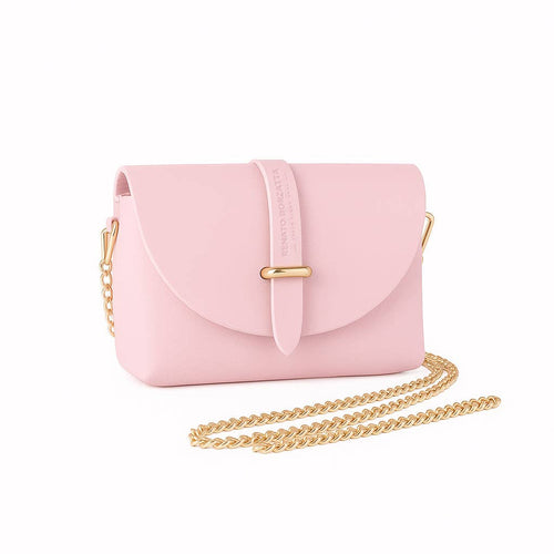 Pink Italian leather mini bag displayed with gold chain shoulder strap laid in front