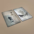 Two Tarot of Unknown Shadows cards lying flat showing The Chariot and another card