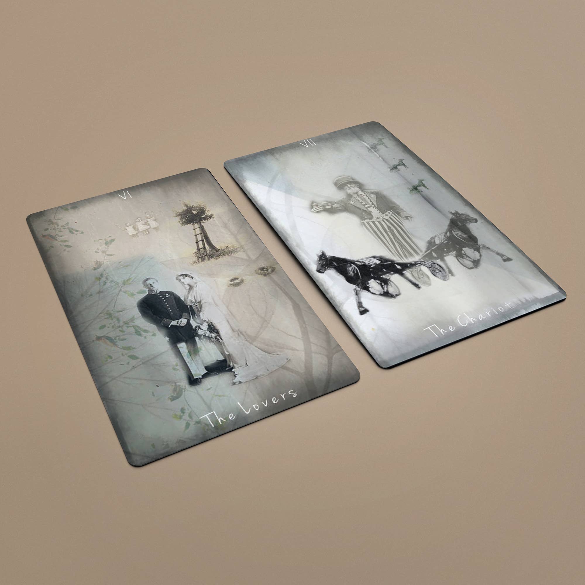 Two Tarot of Unknown Shadows cards lying flat showing The Chariot and another card