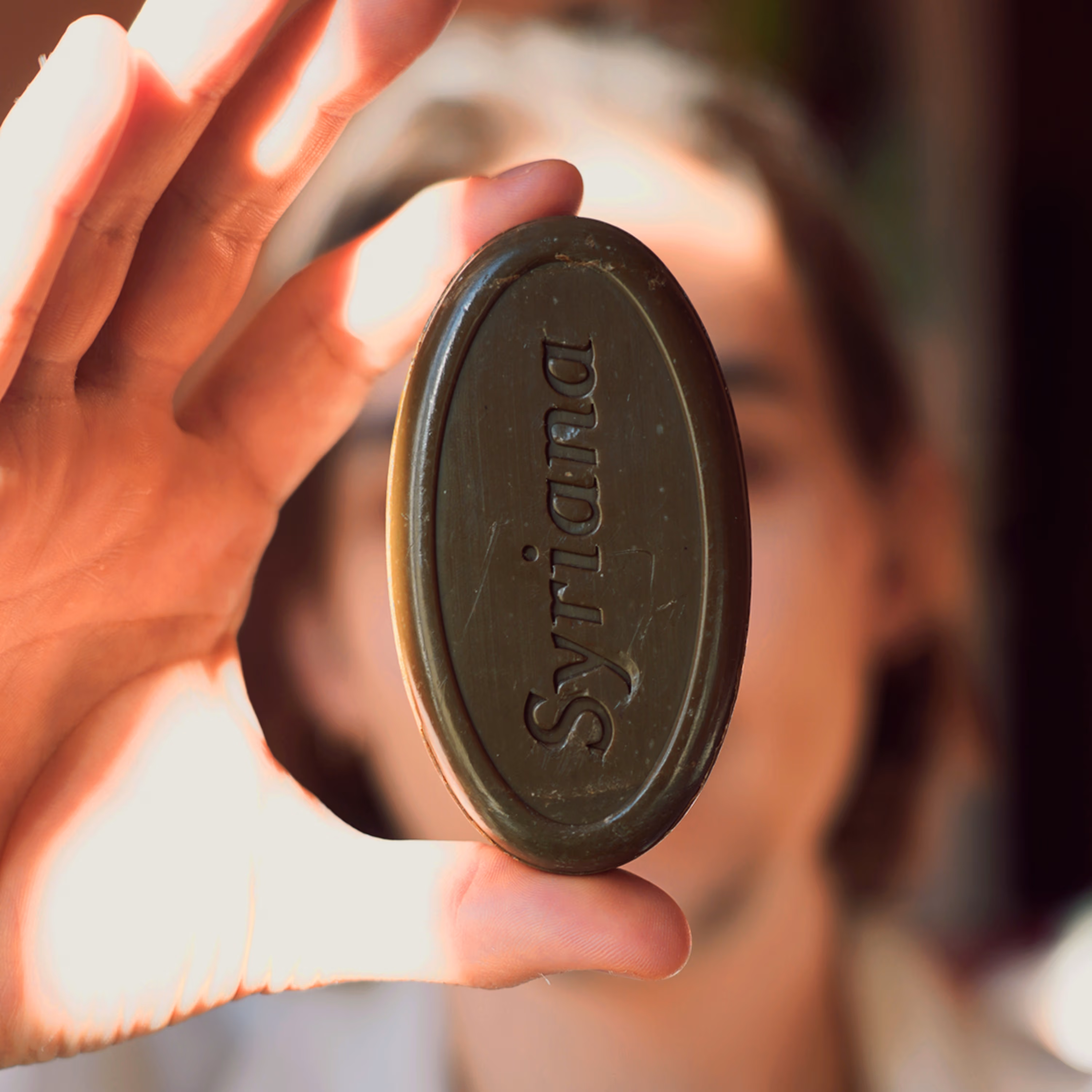 Close up side view of Black Musk Aleppo soap showing traditional cut edges