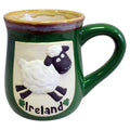 Green pottery mug featuring a white relief sheep design and Ireland text