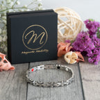 Magnetic Mobility Meadowsweet Night 4in1 Magnetic Bracelet – back view – visible internal red, black, and white elements.