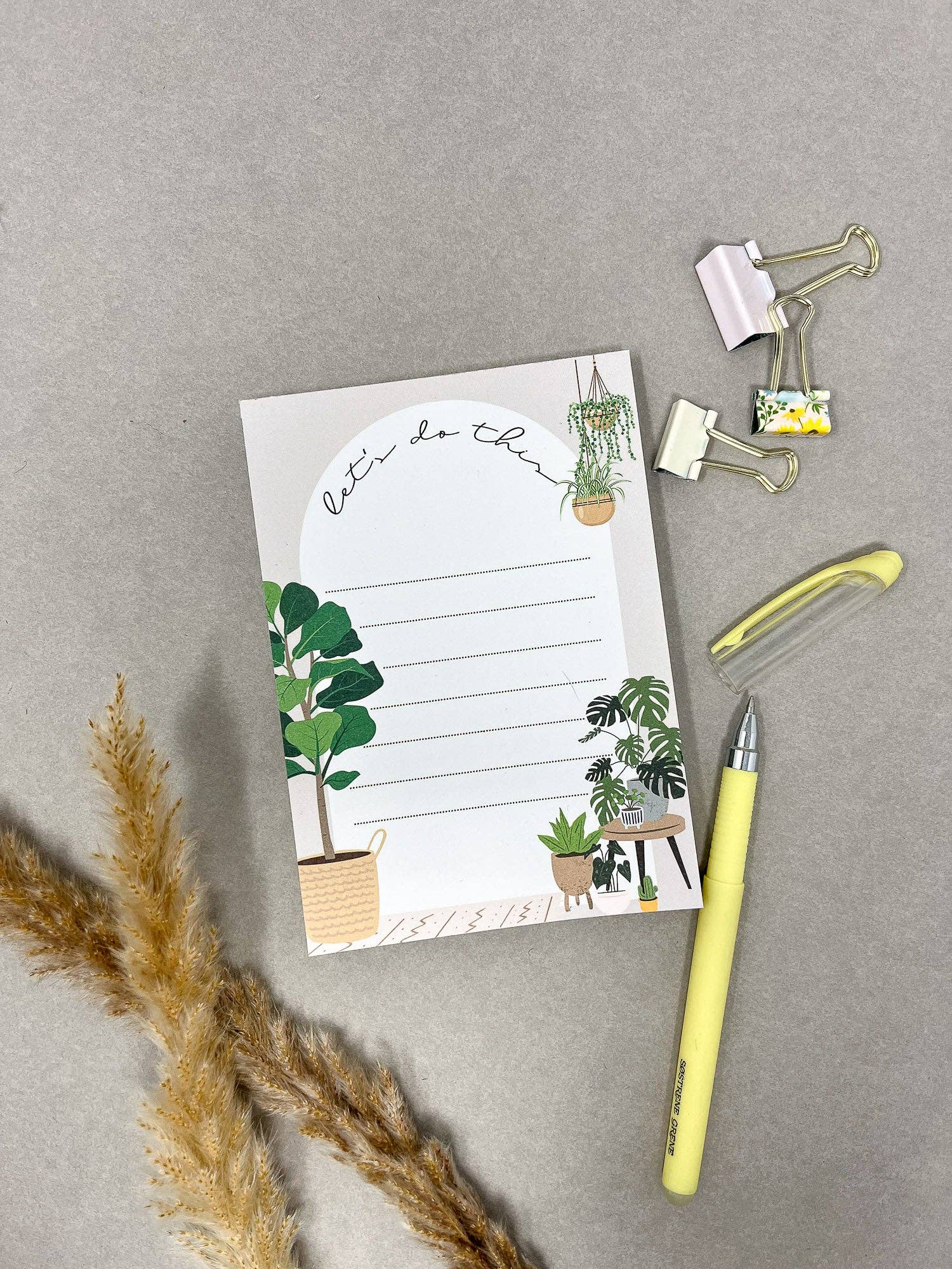 Home A6 notepad in plastic packaging with gold clips