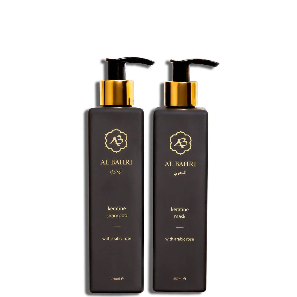Pair of Al Bahri Keratin Shampoo and Mask black bottles with gold pumps