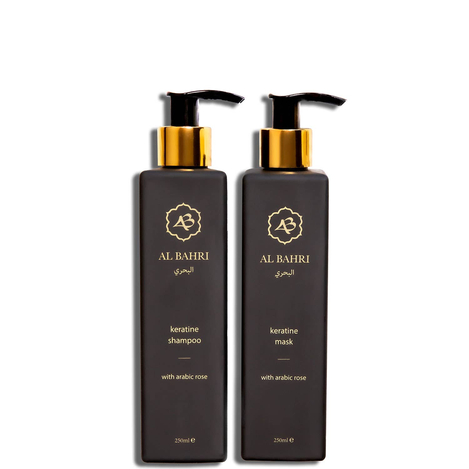 Pair of Al Bahri Keratin Shampoo and Mask black bottles with gold pumps
