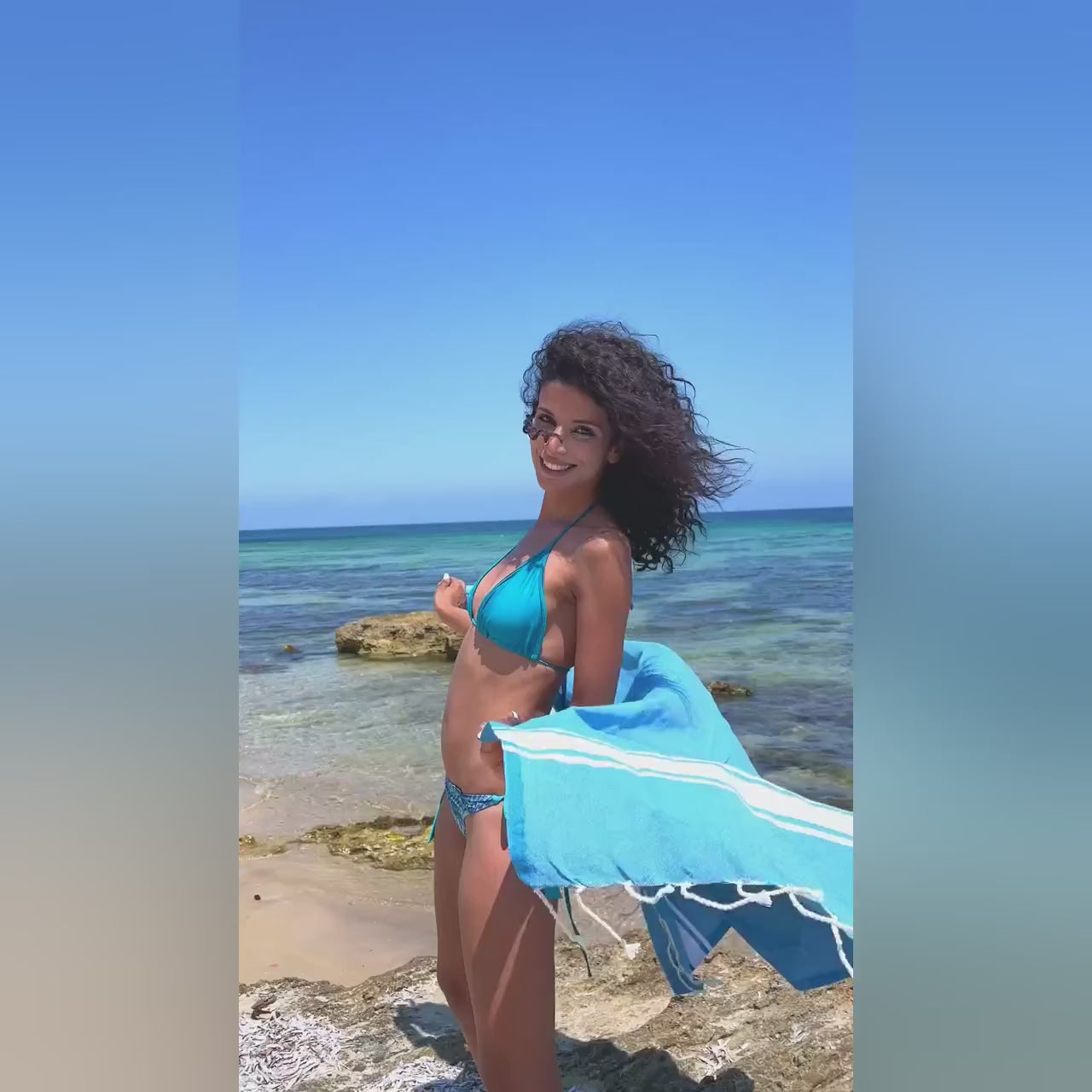 Ipanema Navy & White Fouta Towel 1x2m - video - lifestyle - woman with the towel on the beach.